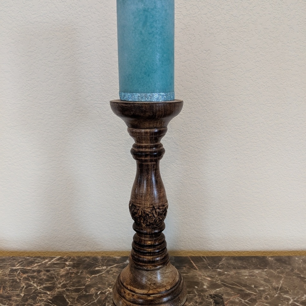 Carved wooden candle stand